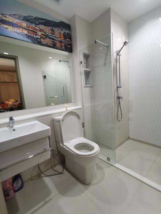 Modern bathroom with glass shower enclosure and vanity