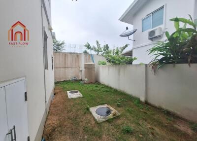 Backyard with HVAC unit and greenery