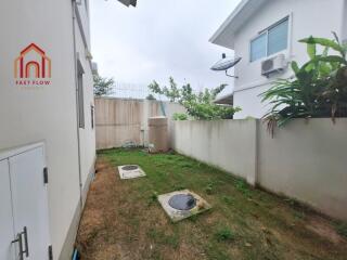 Backyard with HVAC unit and greenery