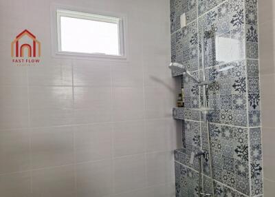 Modern bathroom with patterned tile shower