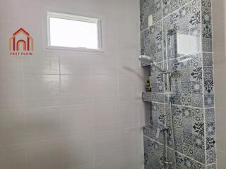 Modern bathroom with patterned tile shower