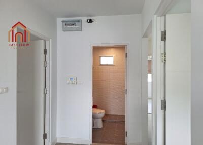 View of a building interior with a door leading to a bathroom