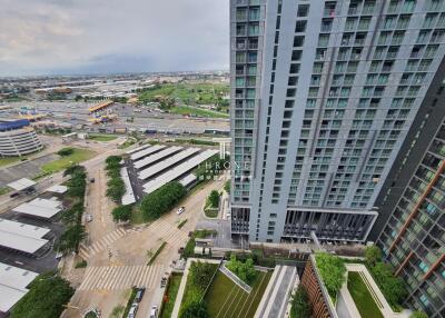 High-rise residential building with surrounding amenities