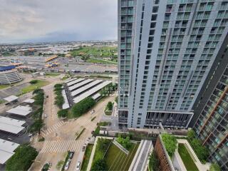 High-rise residential building with surrounding amenities