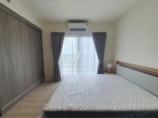 Modern bedroom with large window and AC