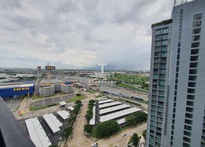 Aerial view of a cityscape featuring IKEA, residential and commercial buildings