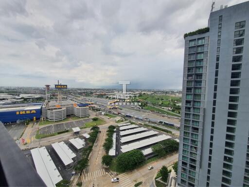 Aerial view of a cityscape featuring IKEA, residential and commercial buildings