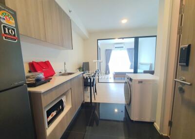 Modern kitchen with appliances and adjacent living area