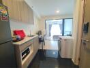 Modern kitchen with appliances and adjacent living area