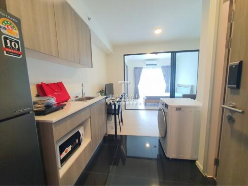 Modern kitchen with appliances and adjacent living area