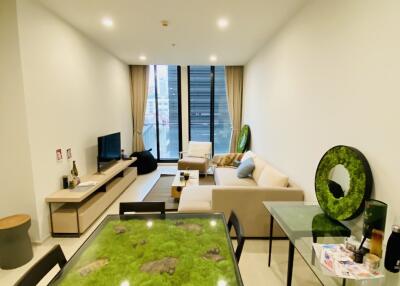 Modern living room with dining area and large windows