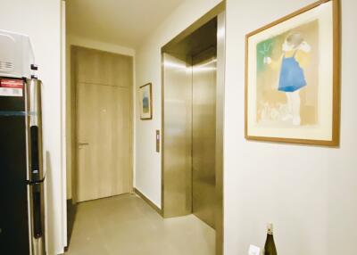 Modern hallway with elevator and wall art