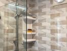 Modern bathroom with a glass shower enclosure and patterned tiling