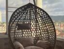 Wicker swing chair on balcony