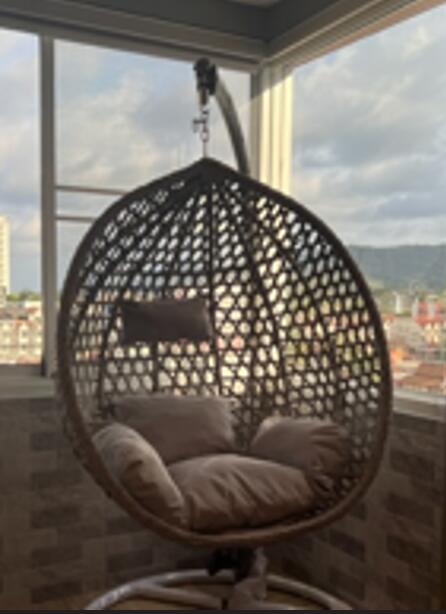 Wicker swing chair on balcony