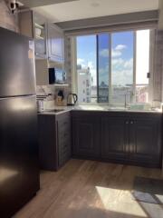 Modern kitchen with appliances and large window