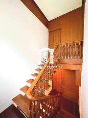 Staircase with wooden railing