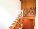 Staircase with wooden railing