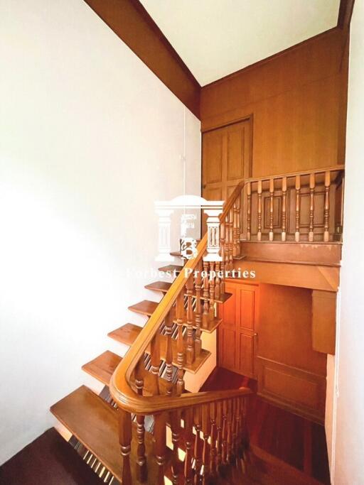 Staircase with wooden railing