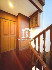 Wooden staircase and upper hallway