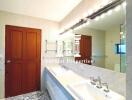 Spacious bathroom with dual sinks and modern fixtures