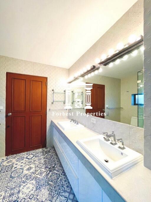 Spacious bathroom with dual sinks and modern fixtures