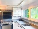 Modern kitchen with large stove and window