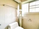 Modern bathroom with tiled walls and window