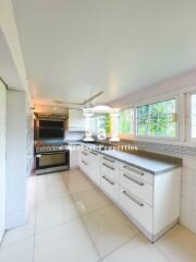 Modern kitchen with ample counter space and natural lighting