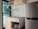 Modern kitchen with cabinetry and appliances