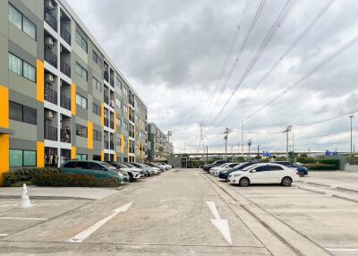 Exterior view of a residential building with parking spaces