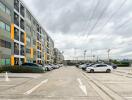 Exterior view of a residential building with parking spaces