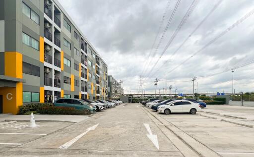 Exterior view of a residential building with parking spaces