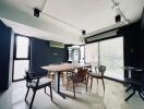 Modern dining area with large windows and contemporary furniture