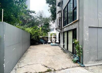 Exterior view of a building with a concrete driveway