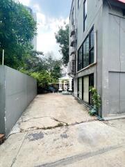 Exterior view of a building with a concrete driveway