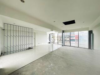 Spacious living room with large windows and unique partition design