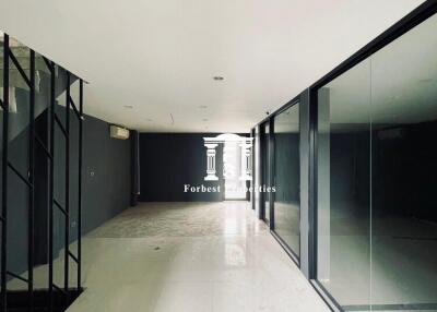 Spacious empty hallway with large glass windows and modern design