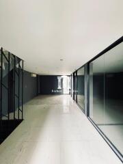 Spacious empty hallway with large glass windows and modern design