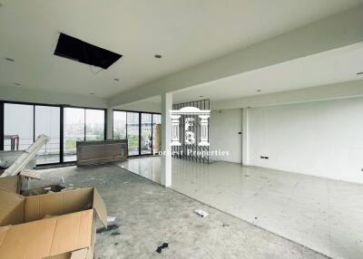 Unfinished living space with large windows