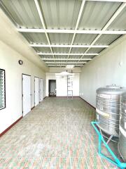 Utility room with storage tanks and multiple doors