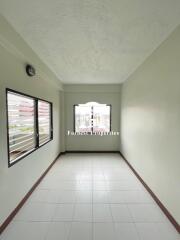 Narrow Room with Tiled Floor and Windows