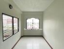 Narrow Room with Tiled Floor and Windows