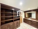 Bathroom with wooden cabinets and large mirror