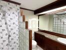 Bathroom with modern fixtures and wooden cabinetry