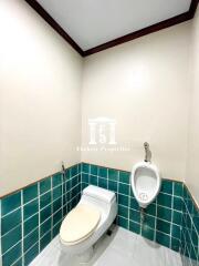 Bathroom with toilet and urinal