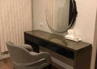 Modern bedroom with vanity and mirror