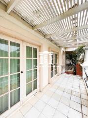 Spacious balcony with tiled floor and glass doors