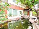 Outdoor area with pond and fish