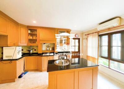 Bright modern kitchen with central island and wooden cabinets